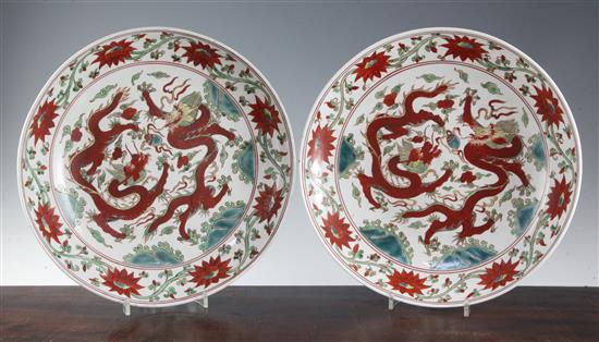 A pair of Chinese polychrome dragon and phoenix dishes, bearing Jiajing marks, 33cm